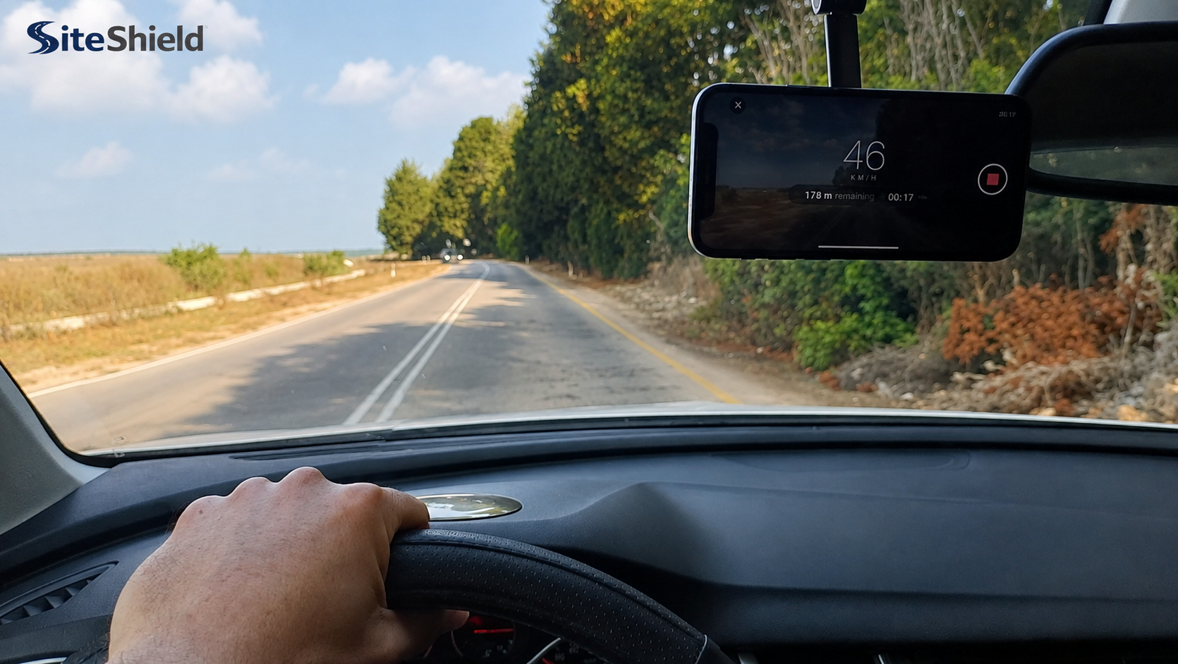 A standard smartphone mounted on a vehicle windshield for field capture